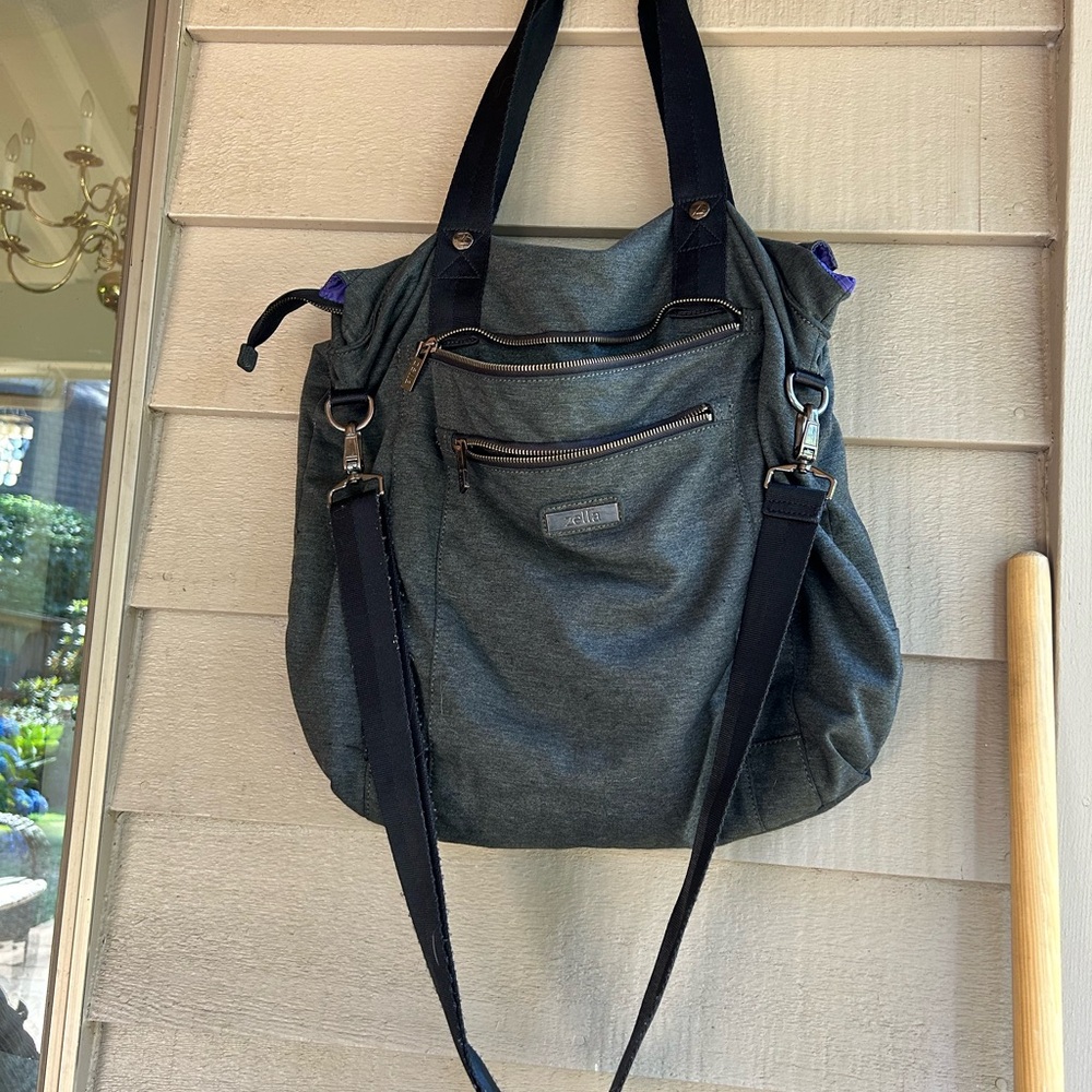Zella gym bag soft gray fabric exterior, purple lining, slots pockets zipper top